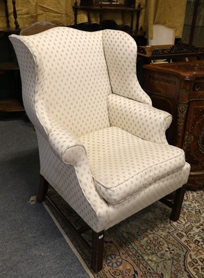 Lot 1264 - A Wing Back Chair, on a mahogany frame