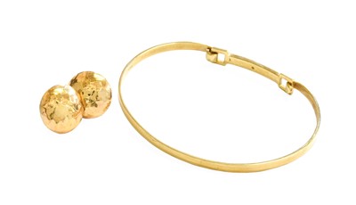 Lot 412 - A 9 Carat Gold Diamond Bangle, the round...