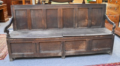 Lot 1266 - An 18th Century Oak Box Settle, with six...