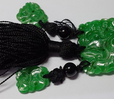 Lot 2076 - A Jade and Onyx Tassel Necklace an onyx bead...