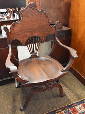 Lot 1312 - An Oak Savonarola-Style Armchair