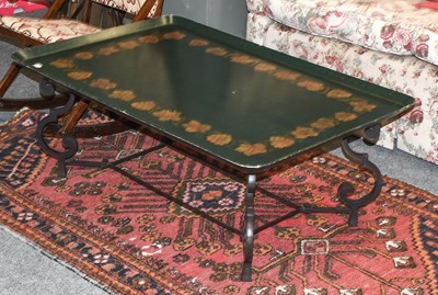 Lot 1280 - A Lacquered Tray Top Coffee Table, on wrought...