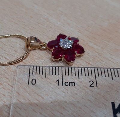 Lot 2038 - A Ruby and Diamond Pendant on Chain the...