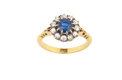 Lot 2140 - A Sapphire and Diamond Cluster Ring the round...