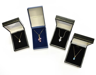 Lot 457 - Four Pendants on Chains, comprising of a pink...