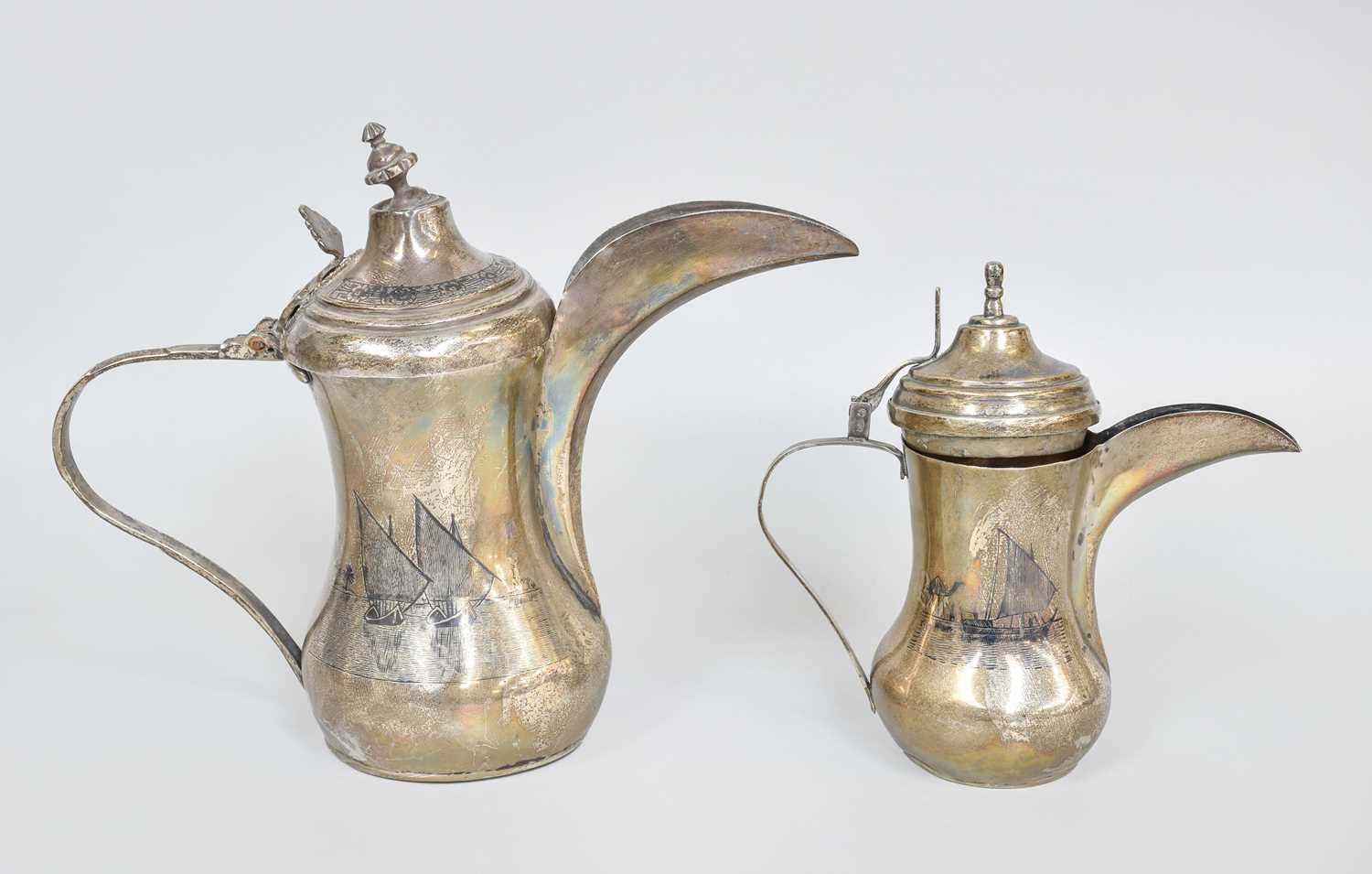 Lot 108 - Two Iraqi Silver and Niello Dallah-Style...