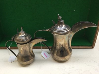 Lot 108 - Two Iraqi Silver and Niello Dallah-Style...