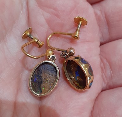 Lot 2082 - A Pair of Opal Earrings the oval cabochon...