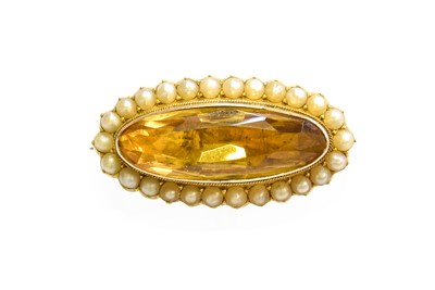 Lot 455 - A Citrine and Split Pearl Brooch, the oval cut...