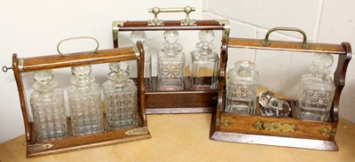 Lot 311 - Three White Metal Mounted Bottle Tantaluses,...