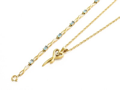 Lot 499 - A 9 Carat Gold Blue Topaz Bracelet, length...