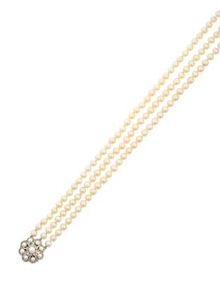 Lot 2094 - A Triple Row Cultured Pearl Necklace, with A...