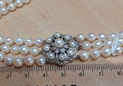 Lot 2094 - A Triple Row Cultured Pearl Necklace, with A...
