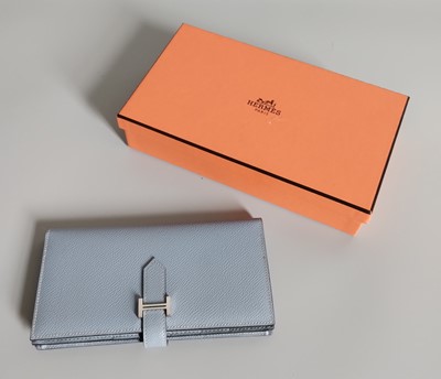 Lot 1066 - A Hermès Bearn Powder Blue Leather Wallet,...