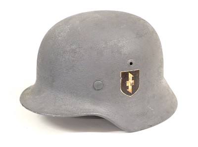 Lot 168 - A German M40 Combat Helmet, with later yellow...