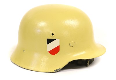 Lot 168 - A German M40 Combat Helmet, with later yellow...