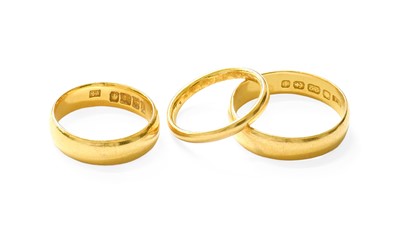 Lot 421 - Three 22 Carat Gold Band Rings, finger sizes...