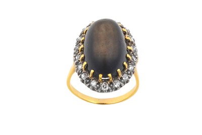 Lot 482 - A Cat's-Eye Stone and Diamond Cluster Ring the...