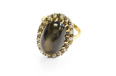 Lot 482 - A Cat's-Eye Stone and Diamond Cluster Ring the...