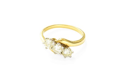 Lot 373 - An 18 Carat Gold Diamond Three Stone Twist...