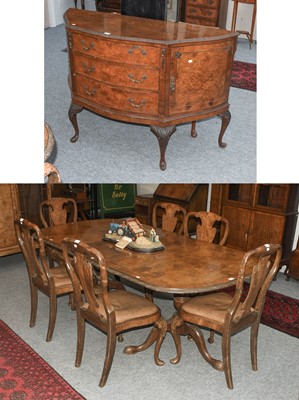 Lot 1308 - A Crossbanded Figured Walnut Extending Dining...