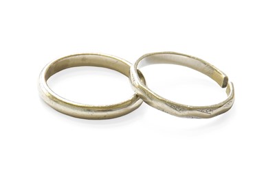 Lot 379 - A Band Ring, stamped 'PLAT', finger size K1/2;...