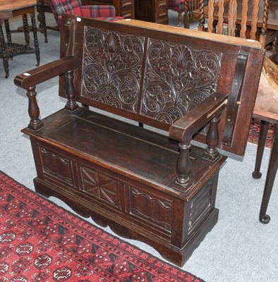 Lot 1324 - A Carved Oak Monks Bench, 122cm by 50cm by 100cm