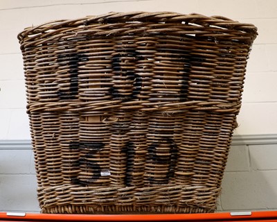 Lot 1213 - An Oversized Wicker Basket, with stencilling,...