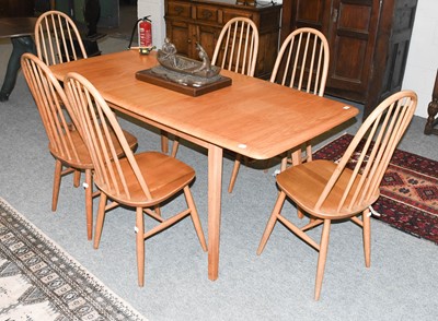 Lot 1398 - An Ercol Style Light Elm Draw Leaf Dining...