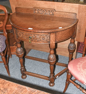 Lot 1332 - A Carved Oak Demi Lune Side Table, 77cm by...