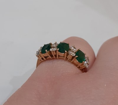 Lot 2089 - An Emerald and Diamond Ring three oval cut...