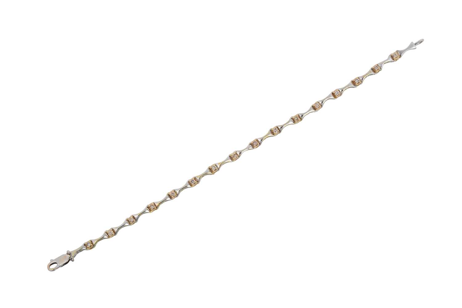 Lot 2112 - A Diamond Bracelet white tapered bars spaced...
