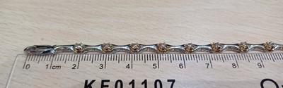 Lot 2112 - A Diamond Bracelet white tapered bars spaced...