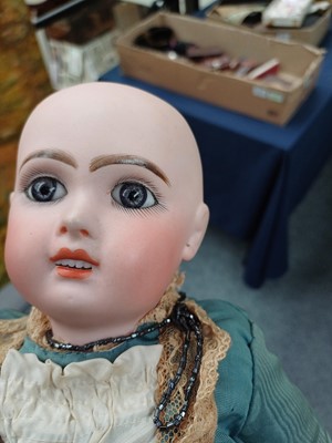 Lot 2090 - Small Bisque Socket Head Doll with fixed blue...