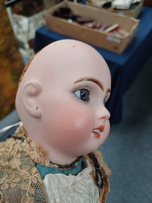 Lot 2090 - Small Bisque Socket Head Doll with fixed blue...
