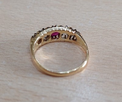 Lot 2047 - An 18 Carat Gold Ruby and Diamond Five Stone...