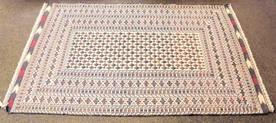 Lot 1103 - Afghan Flat Weave Rug, the cream field with...
