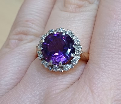 Lot 2131 - An Amethyst and Diamond Cluster Ring the round...