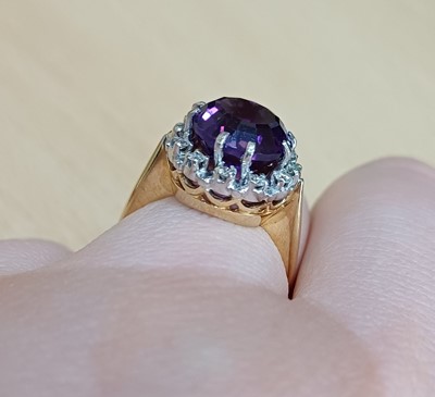 Lot 2131 - An Amethyst and Diamond Cluster Ring the round...
