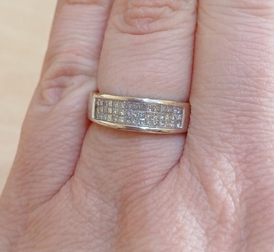 Lot 2025 - An 18 Carat White Gold Diamond Half Hoop Ring,...