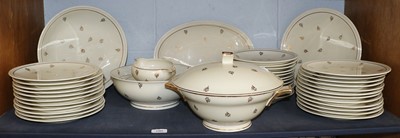 Lot 180 - A Limoges Part Dinner Service, on a cream...