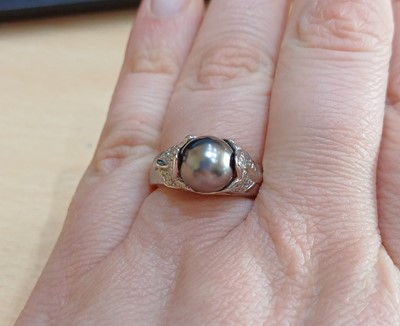 Lot 2020 - A Grey Cultured Pearl and Diamond Ring the...