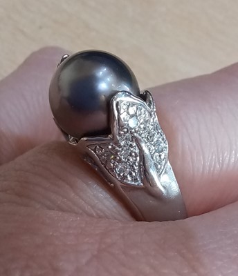 Lot 2020 - A Grey Cultured Pearl and Diamond Ring the...