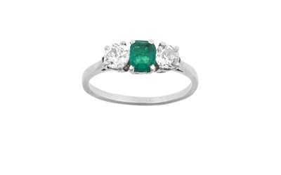 Lot 2017 - An Emerald and Diamond Three Stone Ring the...