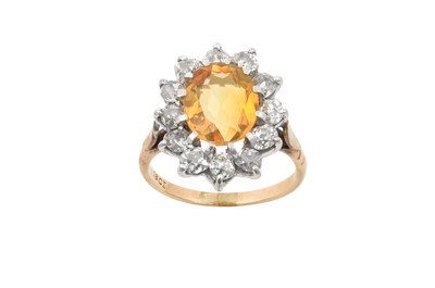 Lot 2268 - A Citrine and Diamond Cluster Ring the oval...