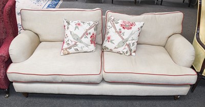 Lot 1302 - A Modern Two Seater Sofa, in beige upholstery...