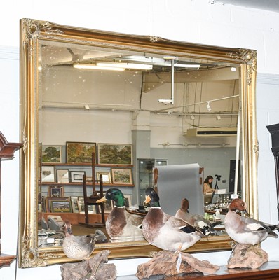 Lot 1252 - A Reproduction Gilt Framed Mirror, with...