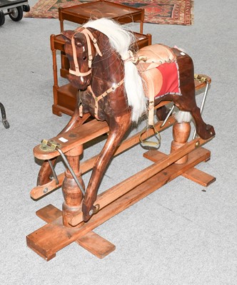 Lot 1168 - A Wooden Rocking Horse, with leather tack on a...