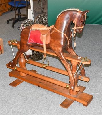 Lot 1168 - A Wooden Rocking Horse, with leather tack on a...