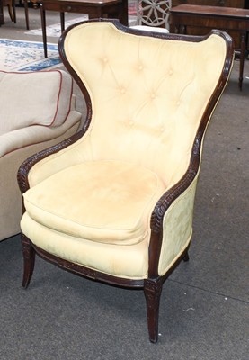 Lot 1301 - A Button Back Wing Chair, with carved and...